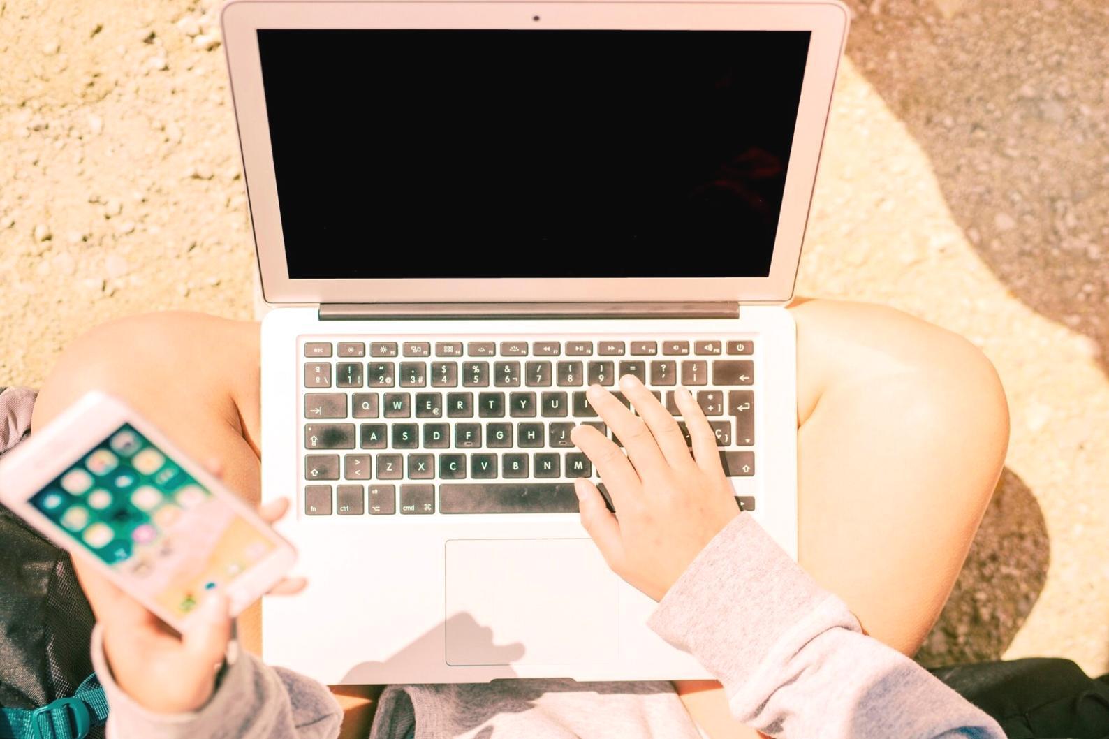 Designer working with interface design tools on screen
